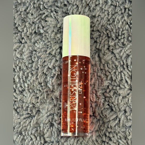 NWT Paris Hilton lip oil, scent: coconut - Picture 1 of 1